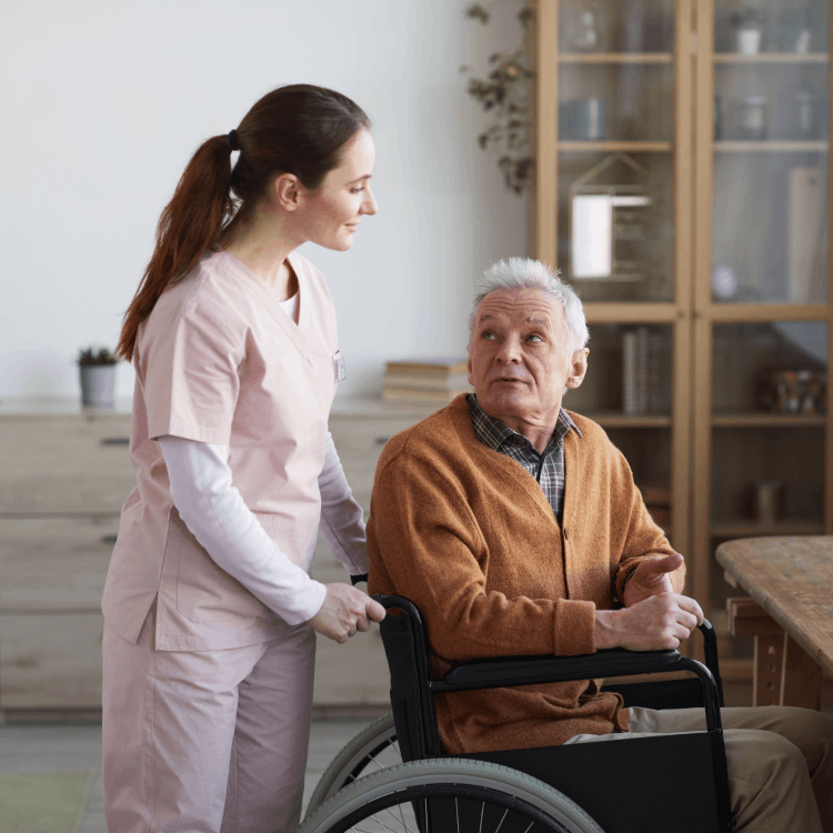 young-woman-assisting-senior-man-in-wheelchair-2021-09-24-04-16-54-utc Professional Painting Services for Assisted Living Facilities